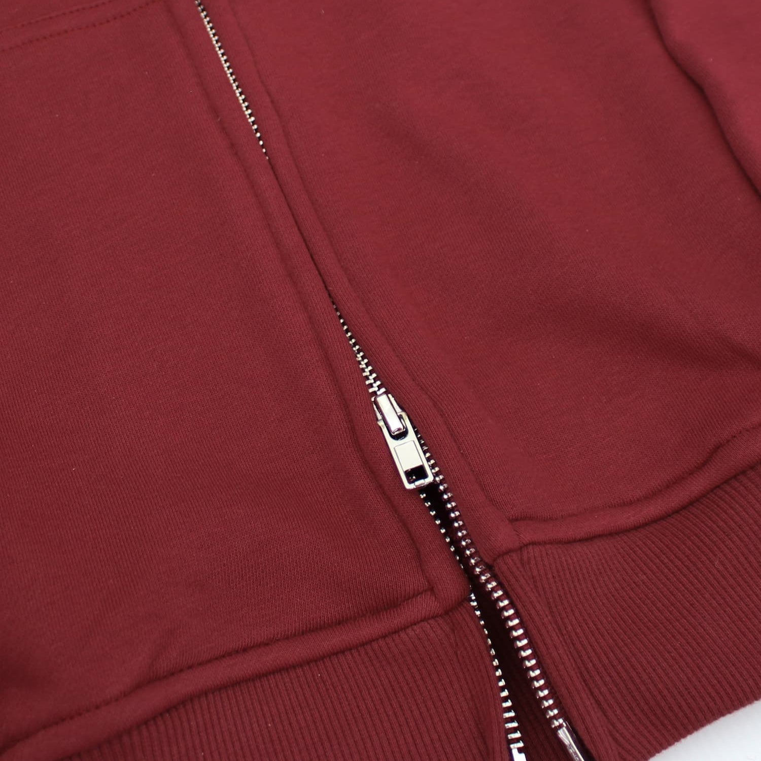 Close-up of a red jacket with a zipper