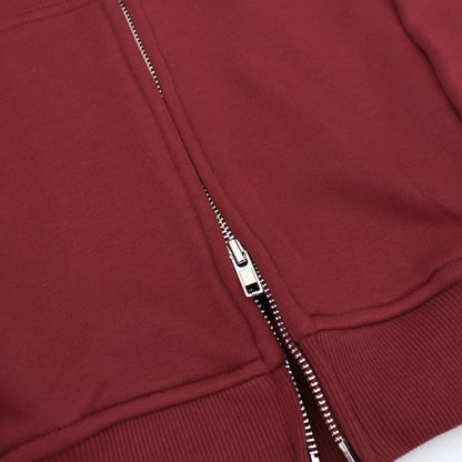 Close-up of a red jacket with a zipper